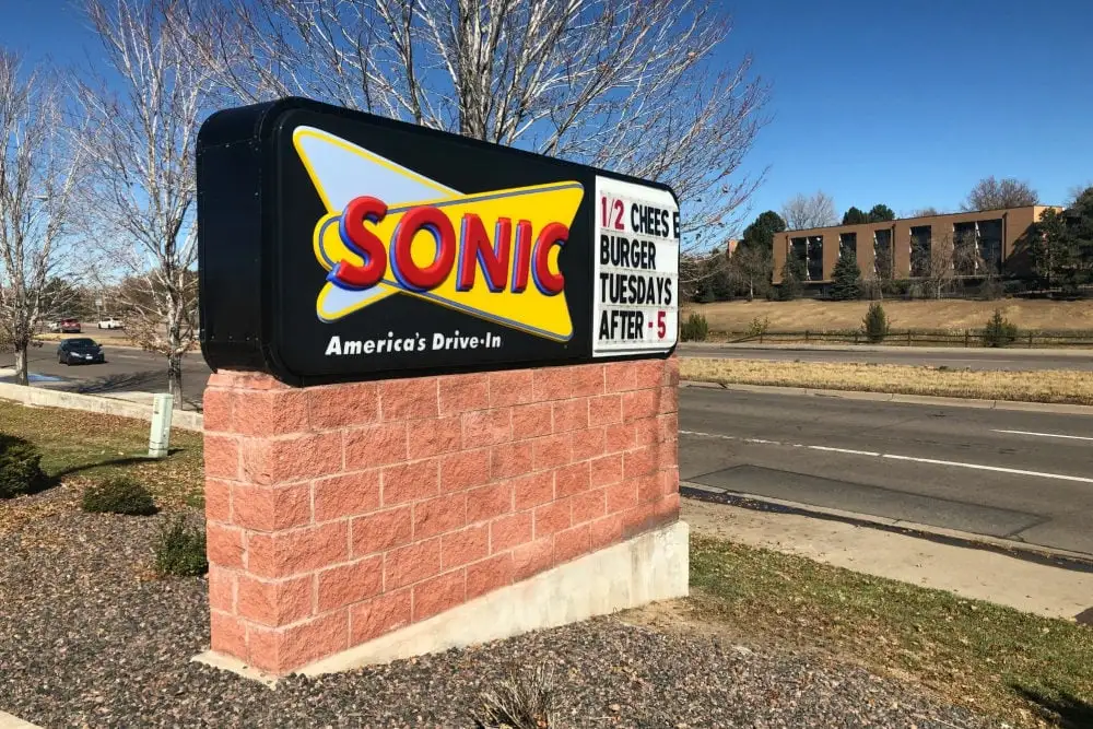 sonic drive-in advertising board is shown to represt sonic lunch hours